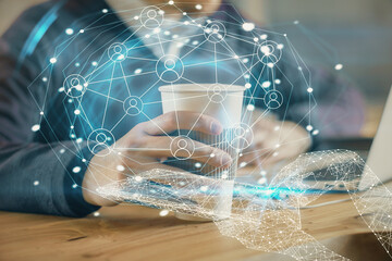 Media network theme hologram with man working on computer on background. Concept of internet...