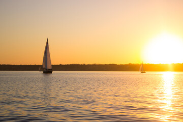 yacht in the setting sun on the water