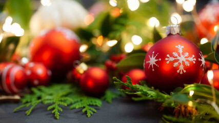 Christmas Balls with green leaves on Background
