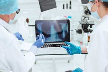close up. doctors discussing an x-ray of the lungs.