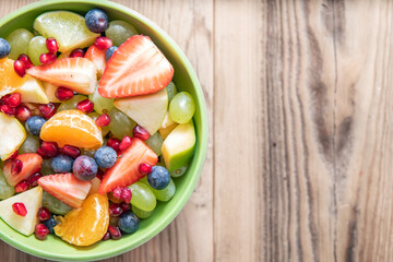 Portion fruit salad in a bowl . Healthy meal
