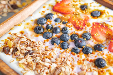 Muesli with yogurt and berries, healthy breakfast