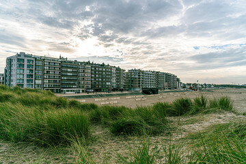 View of the coastline of Zeebrugge combined with the hotel and grasses that lead the eye.  Walking path, flanders coast, great pic for toerism belgium coast, best of flanders