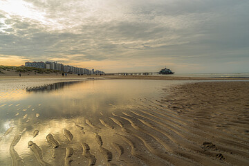 Panoramic view of Blankenberge with the pier combined with reflections of the sea.  Idyllic belgium flanders coast and a beautifull sky