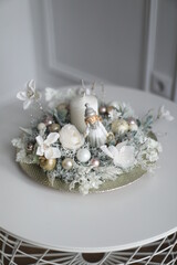 Cristmass decoration  with candle and doll  on table