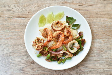 spicy stir fried shrimp and squid curry eat couple with rice