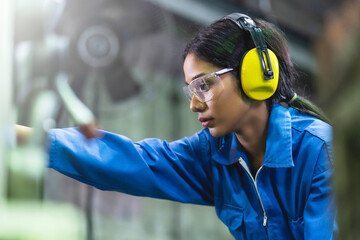portrait asian female Professional engineering wearing uniform and safety goggles Quality control,...