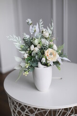 Cristmass decoration  with flowers and pine and candles  on table 
