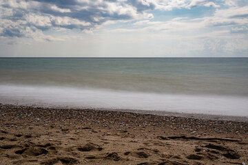 Obraz premium Seascape with a silky water long exposure with a view of the storm .