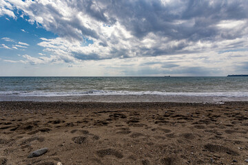  Landscape on the sea with clouds hanging over the water surface.