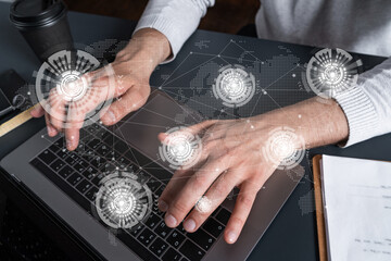 Man using computer. Hands typing laptop. Double exposure with planet earth map hologram. Close up. International eco system concept.