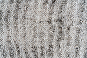 The texture of a dense white woolen fabric. Close-up textile background.