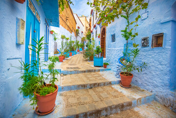 CHEFCHAOUEN, MOROCCO. Beautiful view of the blue city in the medina. Traditional moroccan architectural details and painted houses.  street with door and bright blue walls with arch