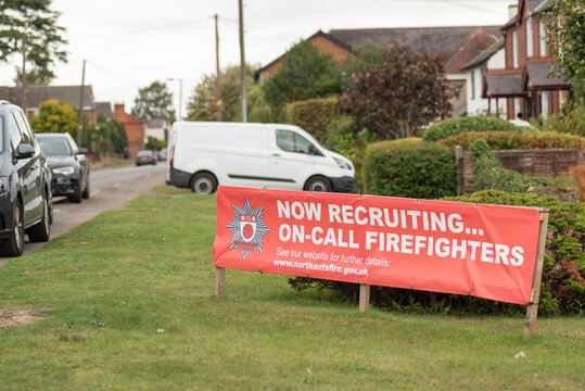 Long Buckby, UK - Sep 16, 2018: Day view Now recruiting on-call firefighters banner in village centre