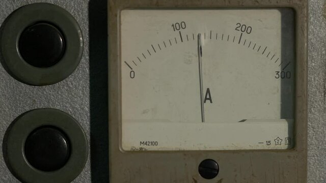 The arrow of the old ammeter twitches and rises to a certain value
