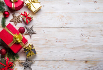 Christmas decor and gift boxes on the wooden table. Christmas or New Year holiday background.