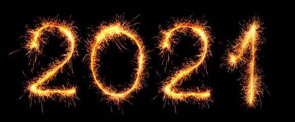 Happy New Year greetings inscription with sparklers figures 2021 on a black background.