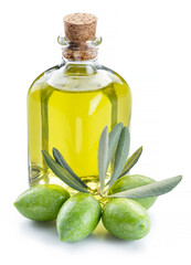 Green natural olives with bottle of olive oil isolated on a white background.