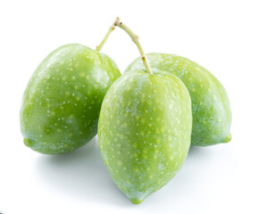 Three green natural olives isolated on a white background.