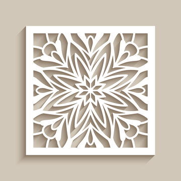 Vintage lace decoration with cutout paper ornament on neutral beige background, square tile with floral stencil pattern, elegant template for laser cutting or wood carving