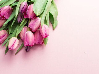 Bouquet pink tulips on lightpink background.