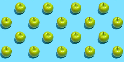 Fruit pattern of fresh green apples on blue background. Top view. Summer concept. Collage