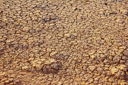 Nature background - cracked and dryed up bottom of the Zayandeh river (Zayanderud) with specific pattern at winter season in Isfahan (Esfahan), Iran, Middle East