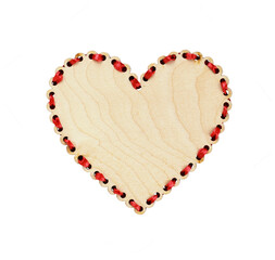 Wooden heart with red ribbon decoration isolated on white