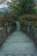 Fototapeta na wymiar A Chinese stone bridge at the lakeside of West lake in Hangzhou, China, autumn time.