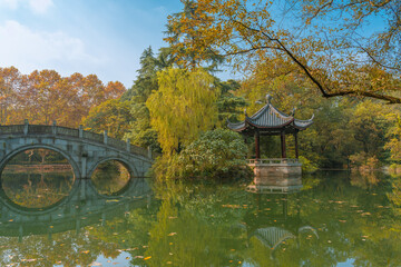 Traditional Chinese garden with pavilion and forest in Hangzhou, China, autumn time.