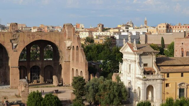 City of Rome in Italy, Roman Forum ancient ruins, zoom out from Basilica di Santa Francesca Romana and Basilica of Maxentius