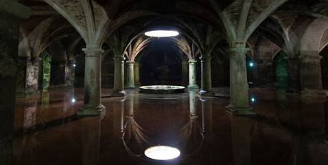EL JADIDA, MOROCCO. The old Manueline Cistern with reflection. Sunlight beam in darkness, dark room on ground floor in Portuguese Cisterns. 
