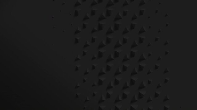 Black surface with wave of scaling pyramids with shadows. Extruding shapes animation loop. Clean dark triangle motion. 4K UHD