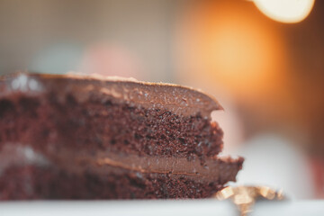 Triangle slice piece of delicious dark chocolate fudge cake