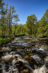 Stream of water from a flat river
