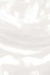 Top view Abstract White cloth background with soft waves.Wave and curve overlapping with different shadow of color,white fabric, crumpled fabric.