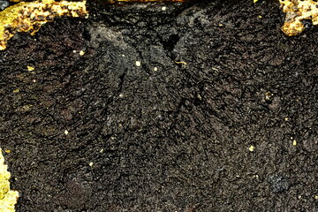 hardened bitumen layer on concrete