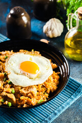 Spicy fried rice with chicken, kimchi and egg