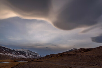 mountains steppe clouds sky road sunset