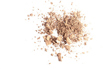 Loose brown shadows isolated on white background. The concept of decorative cosmetics, make-up. Advertising macro photography.