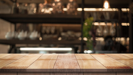 Empty wood table with blur vintage restaurant background.