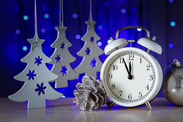 Vintage alarm clock is showing midnight. Happy Year concept.