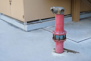 old red fire hydrant on street for emergency fire extinguish