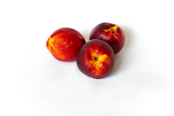 Nectarines on a white background