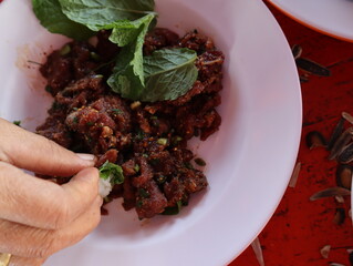 Larb Luad, raw minced meat, raw blood mixed with spices and herbs.THAI FOOD Northeast  part of Thailand
