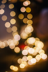 Bokeh from the Christmas garland in a dark room