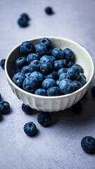 Fresh blueberries in a bowl with white background