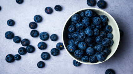 Fresh blueberries in a bowl with white background