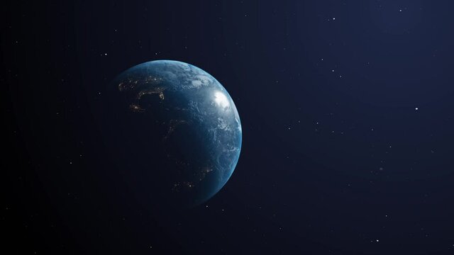 Zoom out of the rotating planet earth in space. Night and day visible 