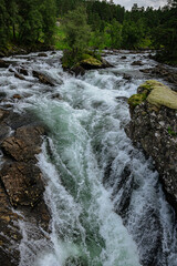 Fototapeta premium Huge waterfall with its river